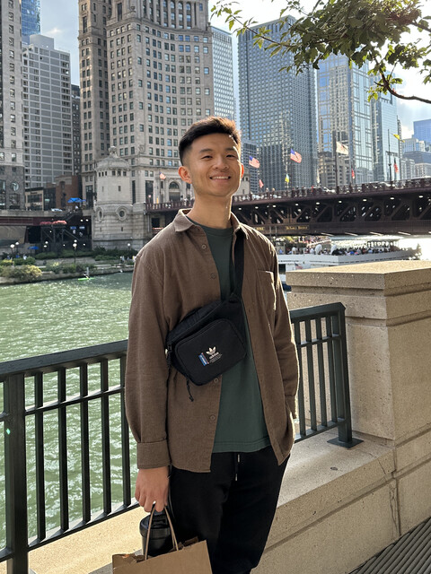 Harrison Chen posing next to the Chicago River